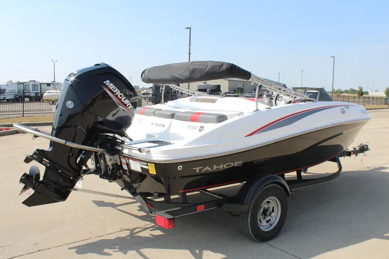 Slide: The Image of 2023 Tahoe T16 boat with Mercury engine on trailer, parked outdoors. - 5