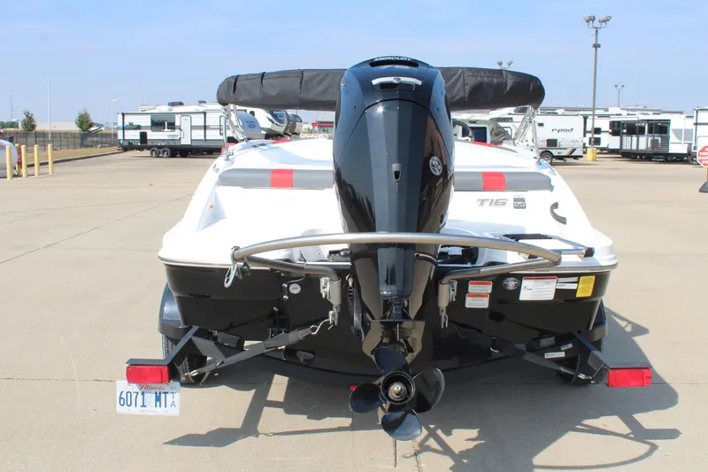 Slide: The Image of 2023 Tahoe T16 boat with outboard motor, parked in a lot with trailers. - 6