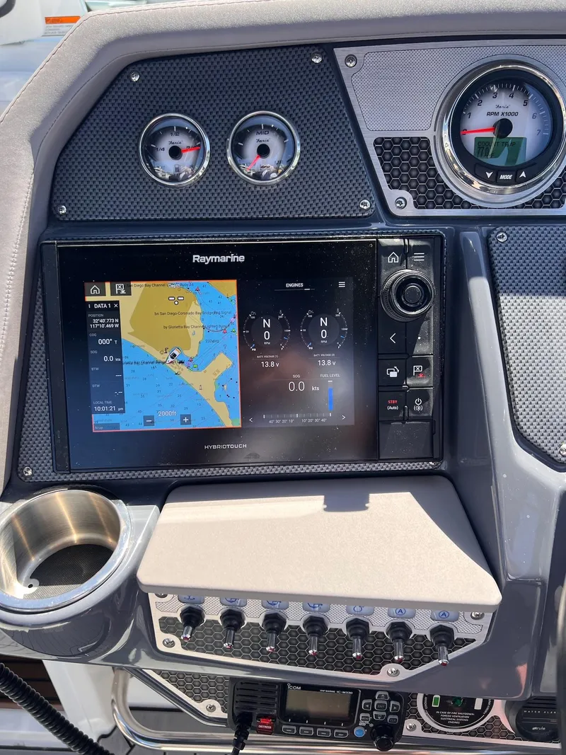 Slide: The Image of Dashboard of 2019 Cruisers Yachts 338 IO with navigation system and gauges. - 11