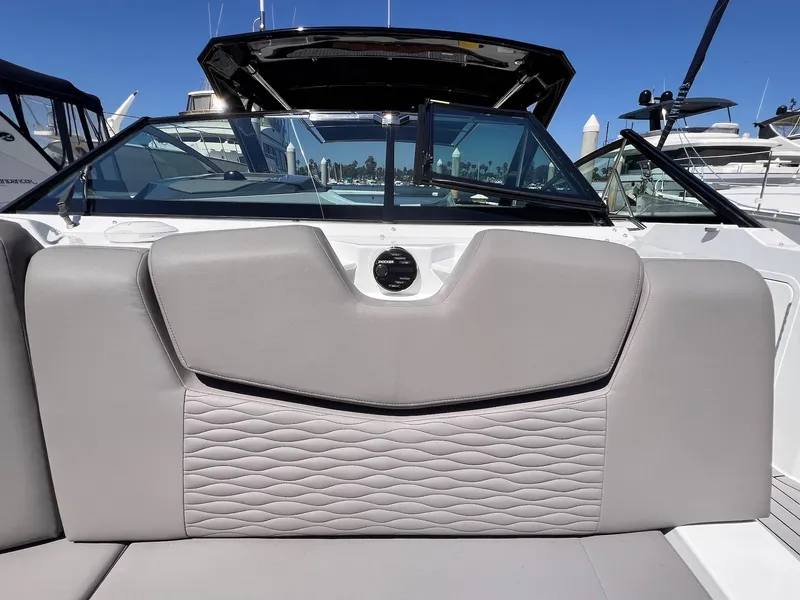 Slide: The Image of 2019 Cruisers Yachts 338 IO boat interior with gray seating and sleek design. - 17