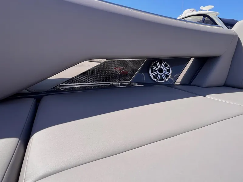 Slide: The Image of 2019 Cruisers Yachts 338 IO interior with speaker and sleek design elements. - 19