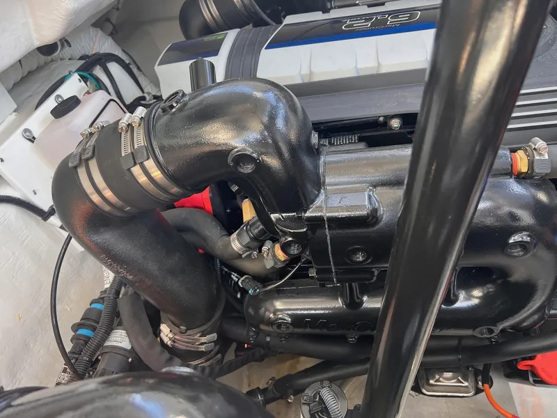 Slide: The Image of Engine compartment of a 2019 Cruisers Yachts 338 IO, showcasing detailed components. - 42