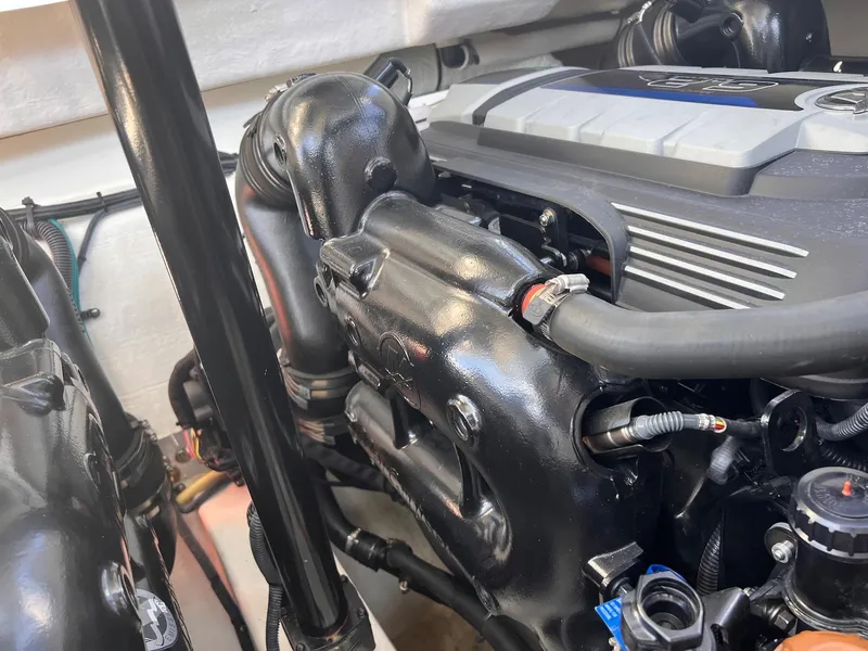 Slide: The Image of Engine compartment of a 2019 Cruisers Yachts 338 Bow Rider, showcasing detailed components. - 43