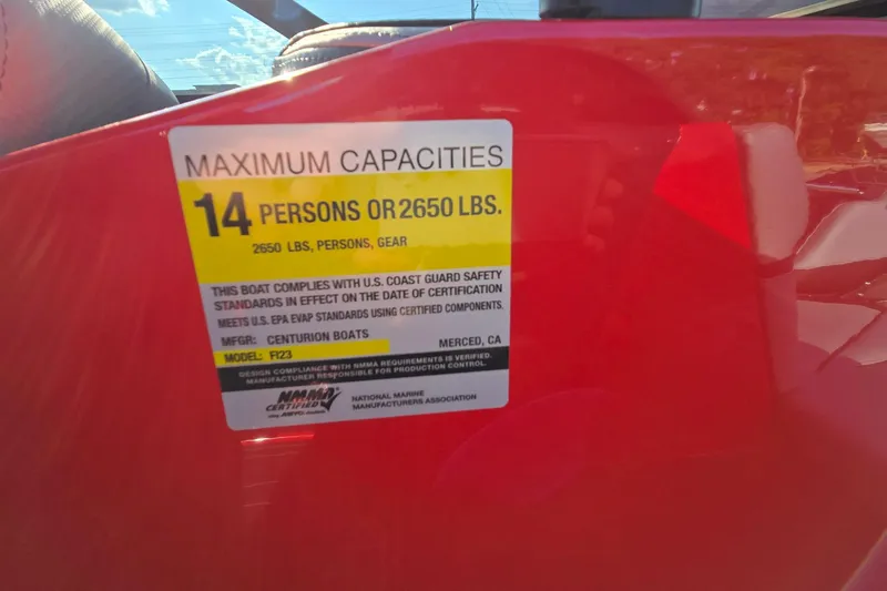Slide: The Image of 2022 Centurion Fi23 boat capacity label, 14 persons or 2650 lbs, safety compliance. - 100