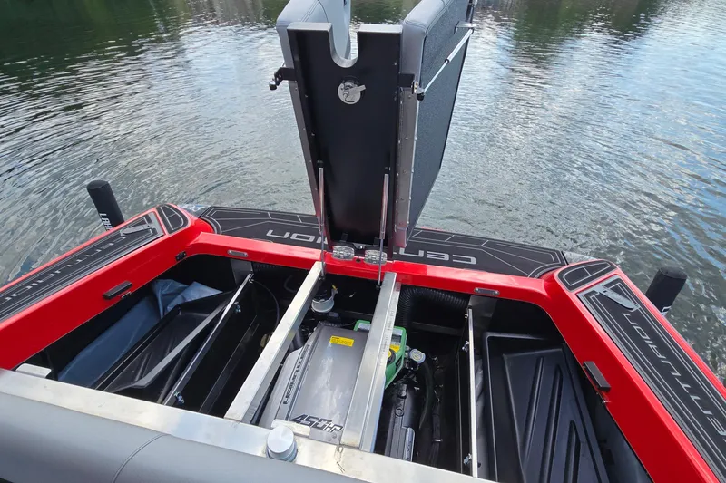 Slide: The Image of 2022 Centurion Fi23 boat engine compartment with open hatch, revealing detailed interior components. - 18