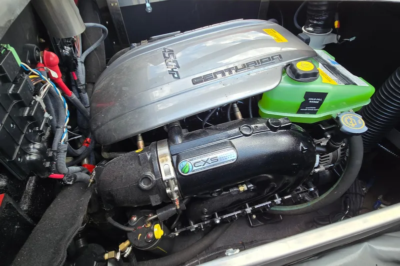 Slide: The Image of 2022 Centurion Fi23 engine compartment showcasing detailed components and wiring. - 19