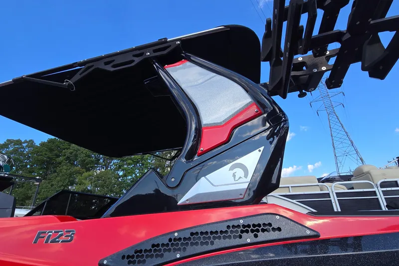 Slide: The Image of 2022 Centurion Fi23 boat with sleek design and modern features against a clear blue sky. - 34