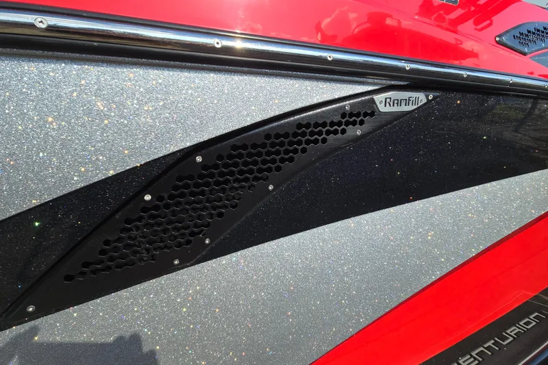 Slide: The Image of 2022 Centurion Fi23 boat with glittery silver and red exterior, featuring Ramfill technology. - 39