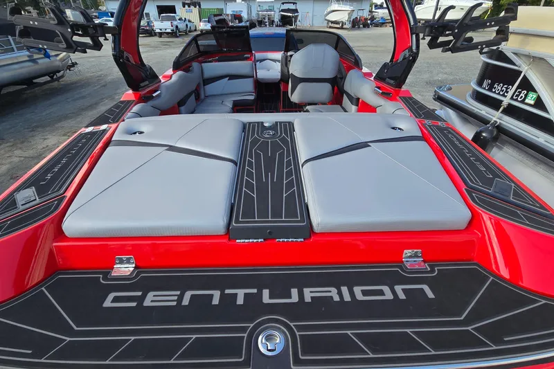 Slide: The Image of 2022 Centurion Fi23 boat with sleek red design and spacious seating. - 40