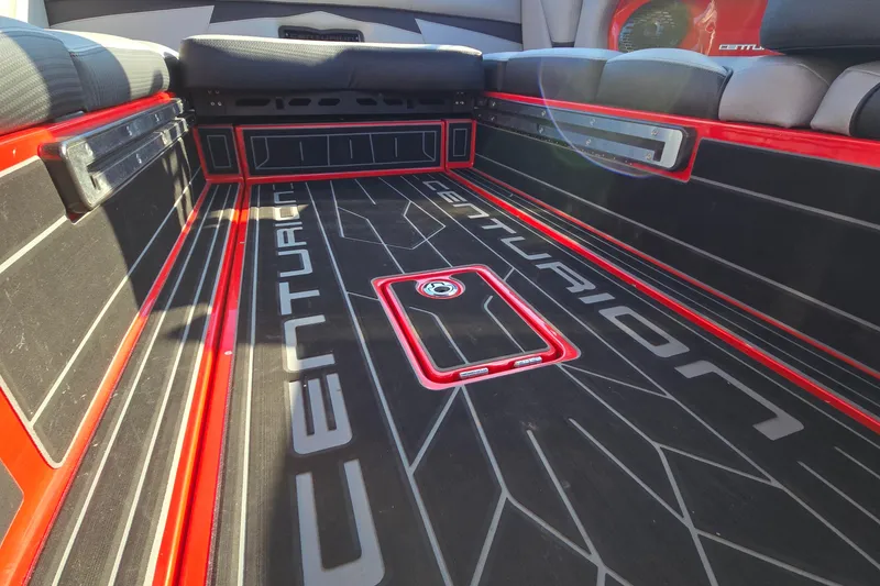Slide: The Image of 2022 Centurion Fi23 boat interior with sleek black and red design. - 47