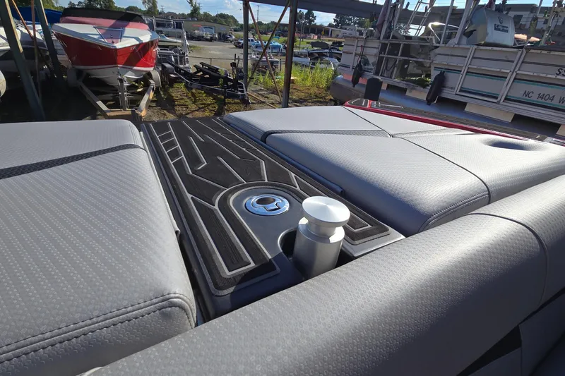 Slide: The Image of 2022 Centurion Fi23 boat interior with sleek gray upholstery and cup holder. - 50