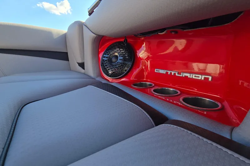 Slide: The Image of 2022 Centurion Fi23 interior with red panel, speaker, and cup holders. - 57