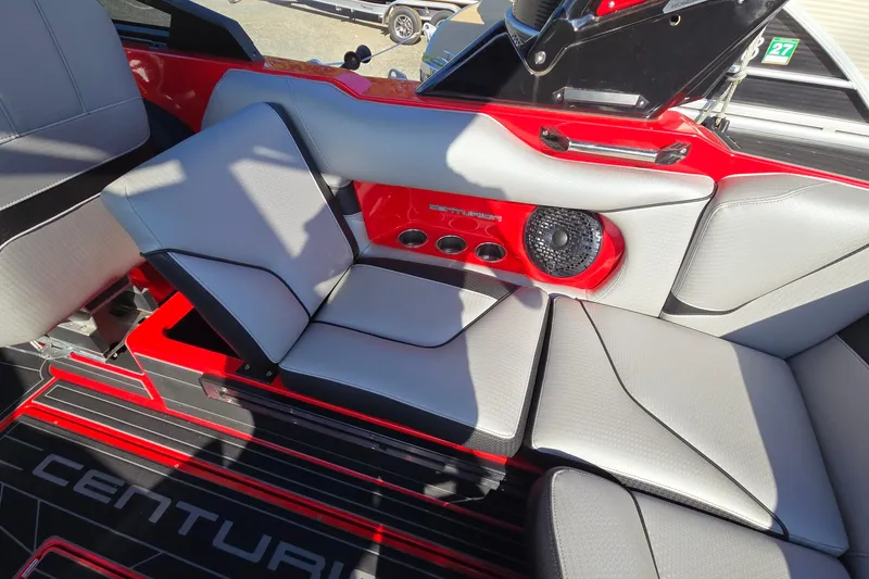 Slide: The Image of 2022 Centurion Fi23 boat interior with red accents and premium seating. - 59