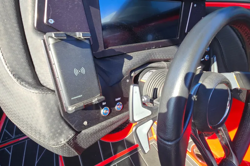 Slide: The Image of 2022 Centurion Fi23 dashboard with steering wheel, touchscreen, and wireless charging pad. - 67