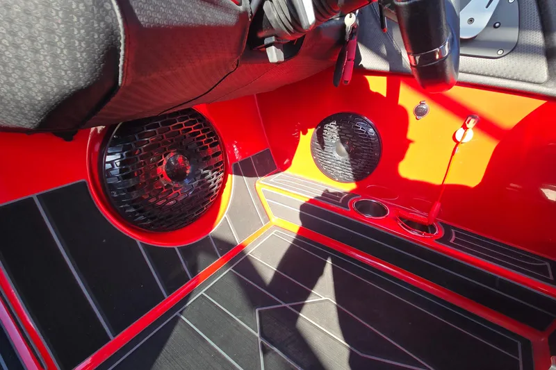 Slide: The Image of 2022 Centurion Fi23 interior with red accents and speaker system. - 70