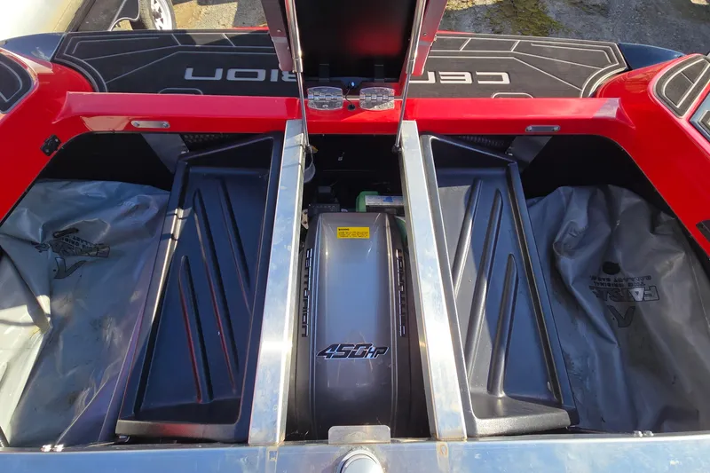 Slide: The Image of 2022 Centurion Fi23 boat engine compartment with 450 HP engine, open storage areas. - 81