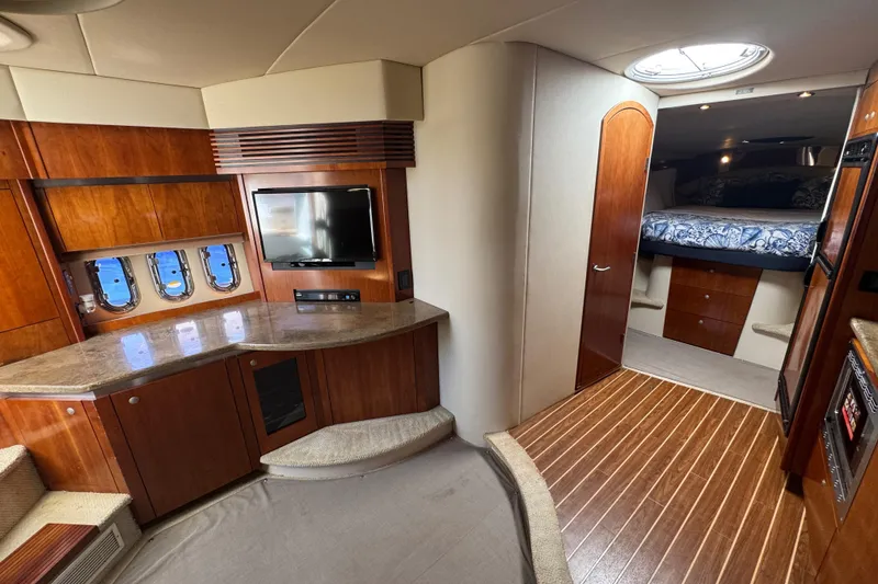 Slide: The Image of Luxurious interior of 2008 Cruisers 420 yacht with wood finishes and cozy bedroom. - 15