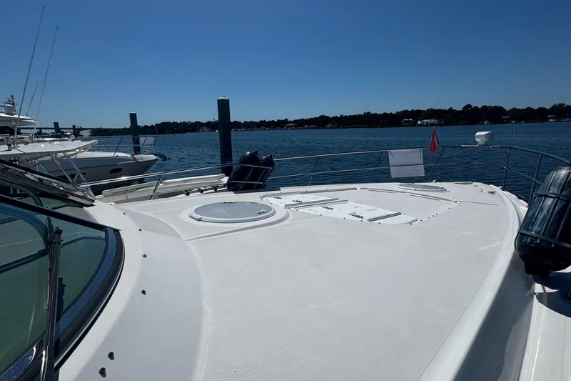 Slide: The Image of 2008 Cruisers 420 yacht docked by the water on a sunny day. - 3