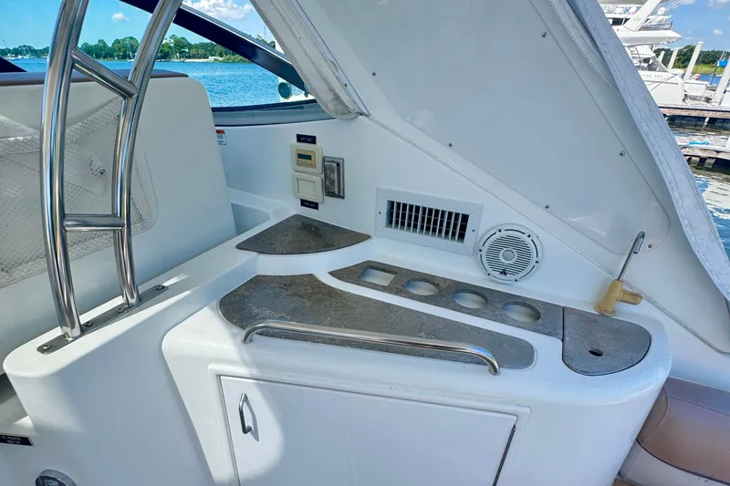 Slide: The Image of 2008 Cruisers 420 yacht interior with kitchenette and stainless steel accents. - 9