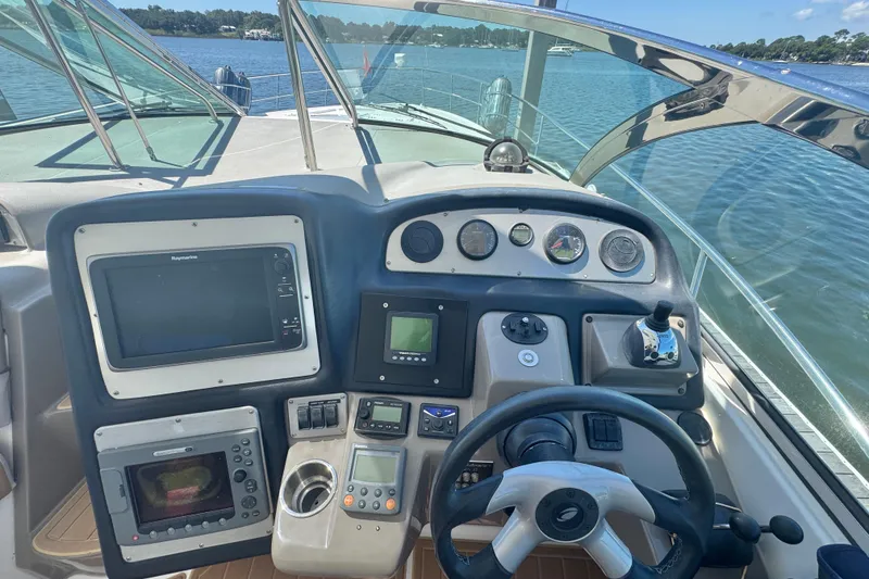 Slide: The Image of Cockpit of 2008 Cruisers 420 yacht with navigation instruments and steering wheel. - 11
