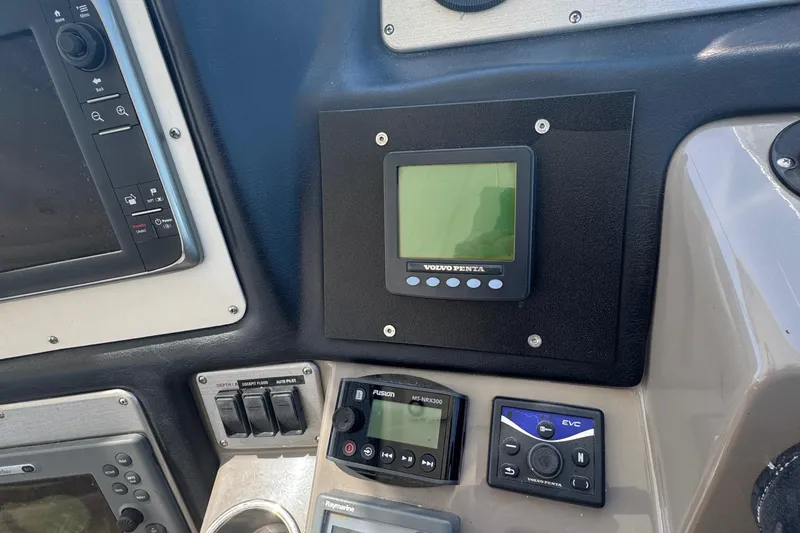 Slide: The Image of Control panel of a 2008 Cruisers 420 boat with Volvo Penta display. - 12