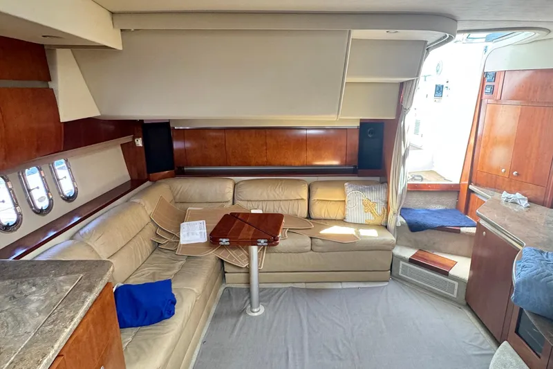 Slide: The Image of Luxurious 2008 Cruisers 420 yacht interior with beige leather seating and wooden accents. - 14