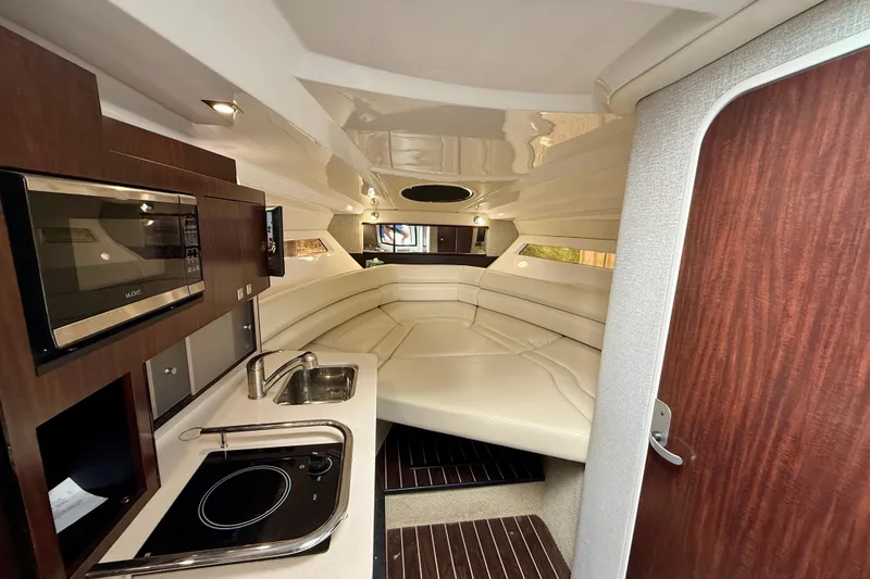 Slide: The Image of Luxurious interior of 2019 Monterey 295 Sport Yacht with kitchenette and seating area. - 15