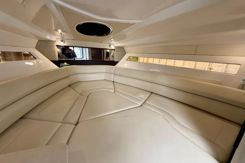 Slide: The Image of 2019 Monterey 295 Sport Yacht interior with beige seating and modern design. - 17