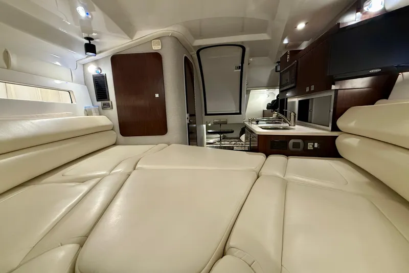 Slide: The Image of Luxurious interior of 2019 Monterey 295 Sport Yacht with cream leather seating and modern kitchenette. - 19