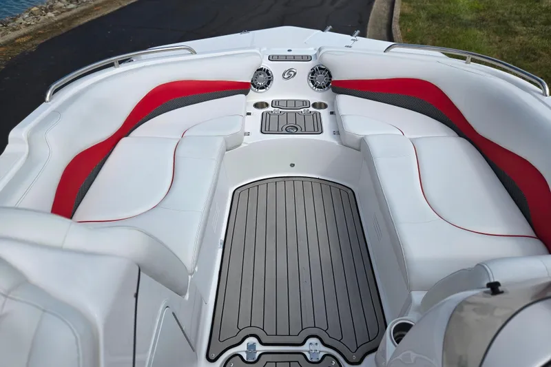 Slide: The Image of 2020 Hurricane SunDeck Sport 202 IO boat interior with white and red seating, sleek design. - 18