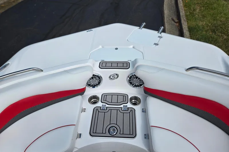 Slide: The Image of 2020 Hurricane SunDeck Sport 202 IO boat interior with red accents and cup holders. - 19