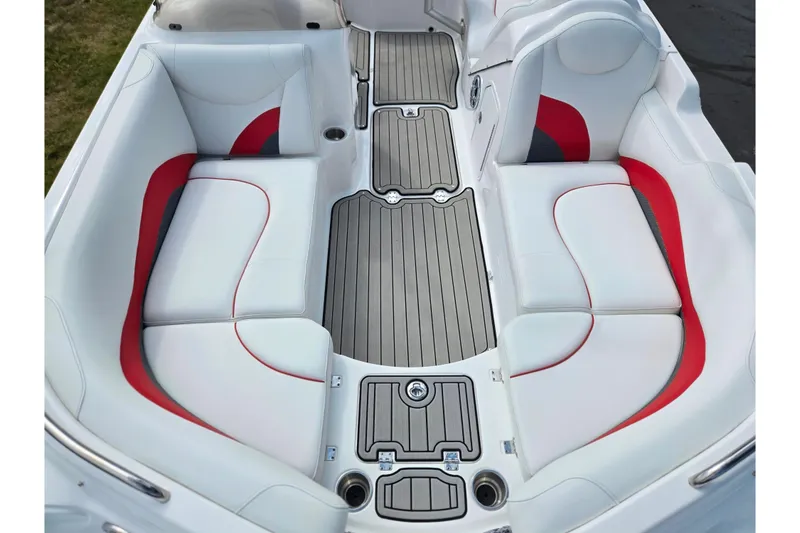 Slide: The Image of 2020 Hurricane SunDeck Sport 202 IO boat interior with white and red seating, gray flooring. - 22