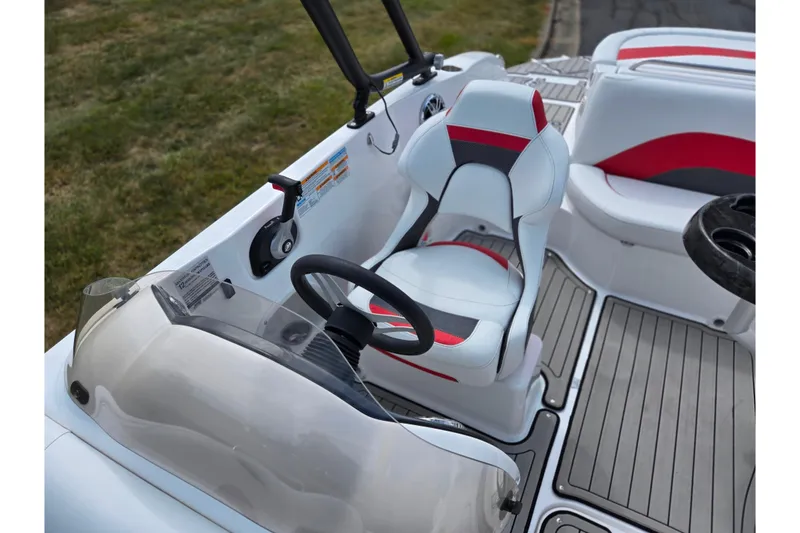 Slide: The Image of 2020 Hurricane SunDeck Sport 202 IO boat interior with steering wheel and seating. - 24