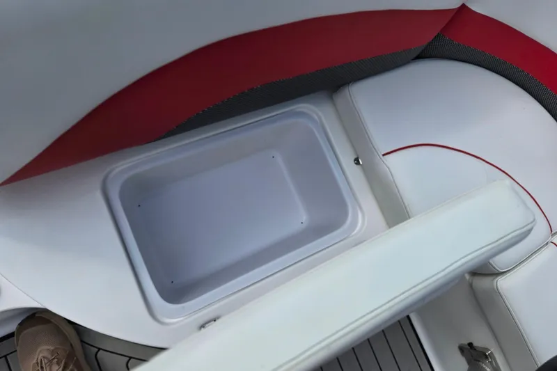 Slide: The Image of 2020 Hurricane SunDeck Sport 202 IO boat interior with storage compartment and seating. - 27