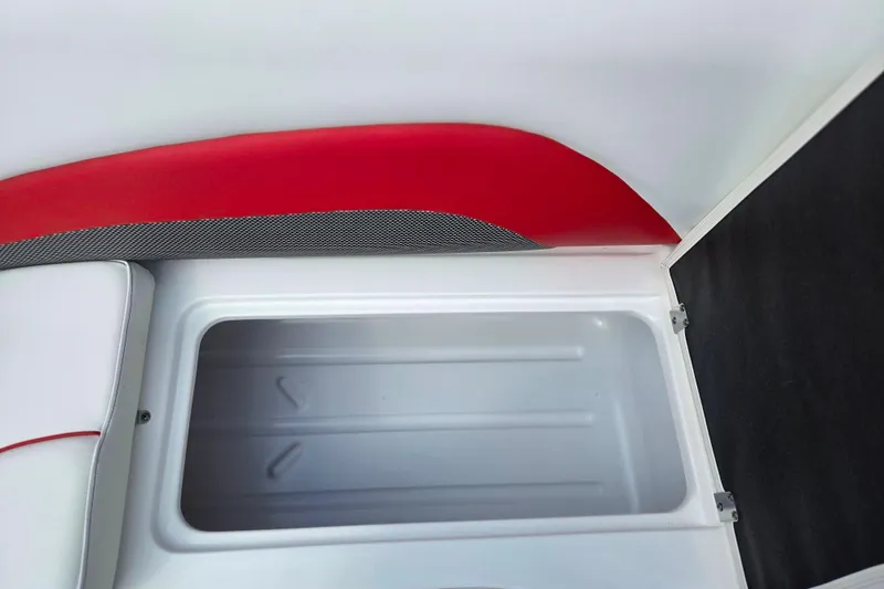 Slide: The Image of 2020 Hurricane SunDeck Sport 202 IO boat storage compartment with red and white interior. - 28