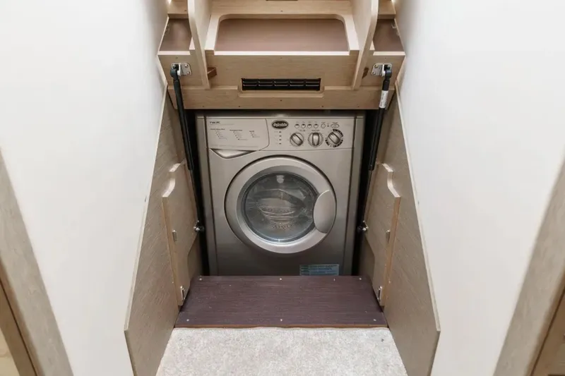 Slide: The Image of Compact washing machine in a 2019 Prestige 520 caravan interior. - 16