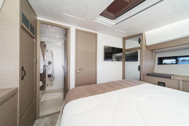 Slide: The Image of Luxurious interior of 2019 Prestige 520 yacht with modern bedroom and ensuite bathroom. - 18
