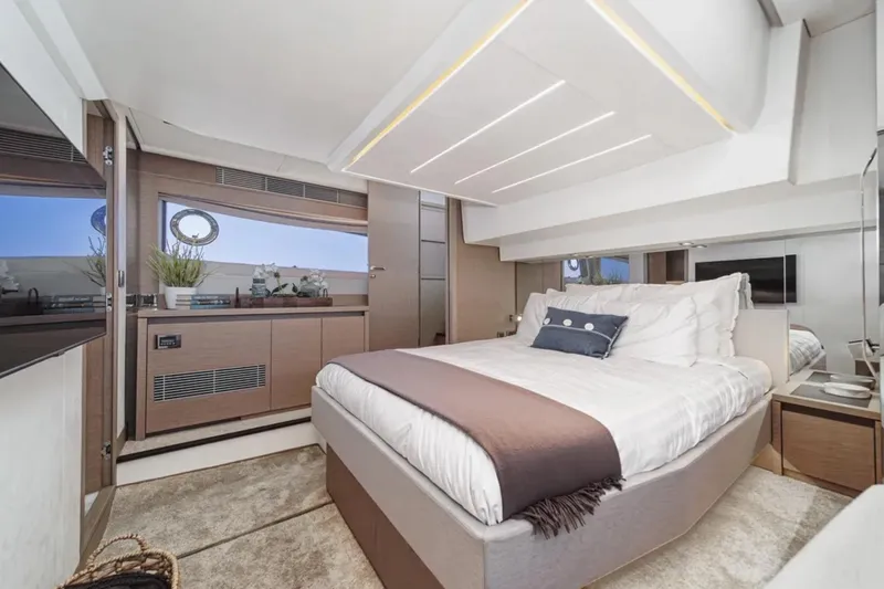 Slide: The Image of Luxurious bedroom interior of 2019 Prestige 520 yacht, featuring modern design and elegant decor. - 21