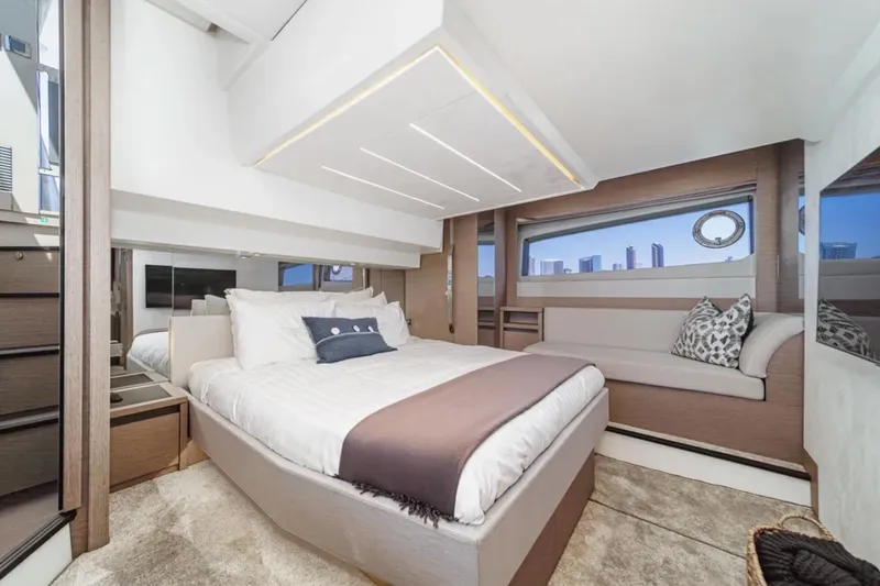 Slide: The Image of Luxurious bedroom interior of 2019 Prestige 520 yacht with modern design and cityscape view. - 22