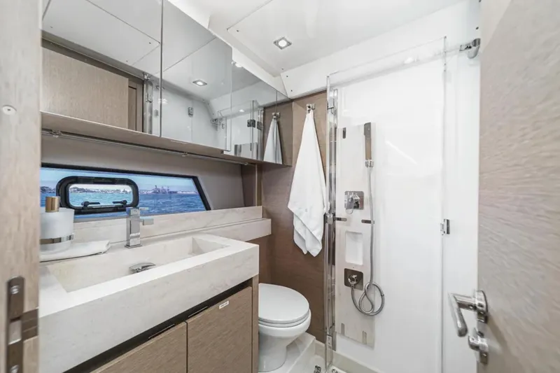 Slide: The Image of Luxurious bathroom in 2019 Prestige 520 yacht with modern fixtures and ocean view. - 24