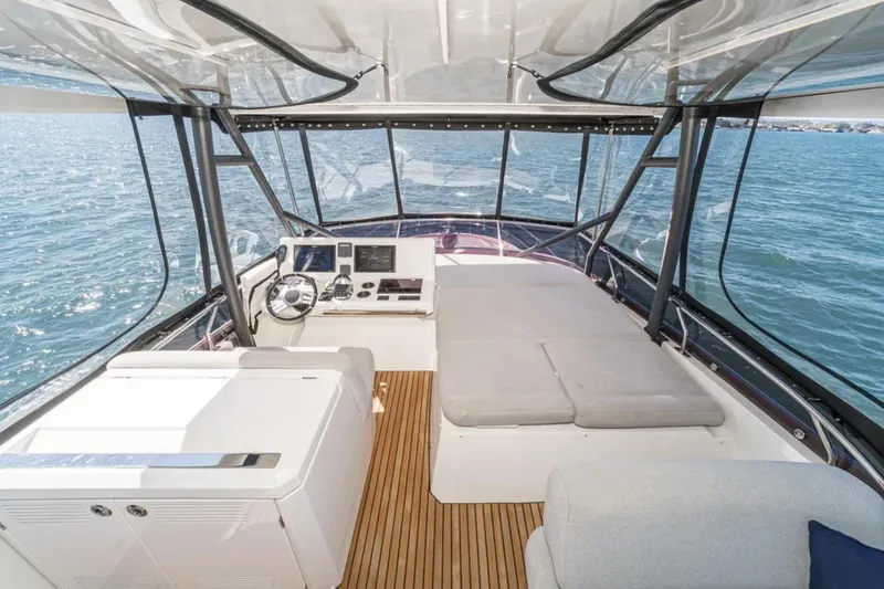 Slide: The Image of Luxurious 2019 Prestige 520 yacht interior with helm, seating, and ocean view. - 27