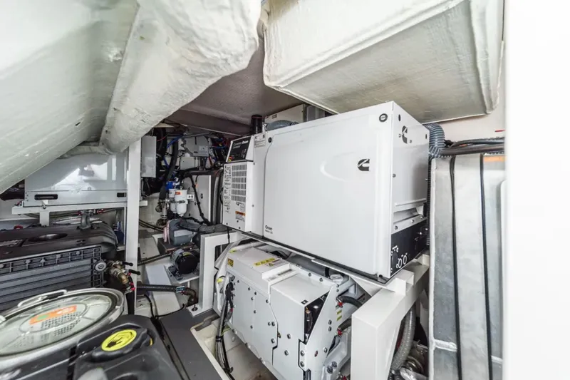 Slide: The Image of Engine room of a 2019 Prestige 520 yacht, showcasing mechanical equipment and systems. - 39