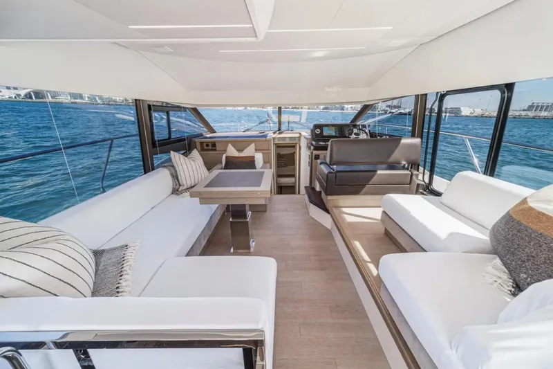 Slide: The Image of Luxurious interior of 2019 Prestige 520 yacht with elegant seating and ocean view. - 9