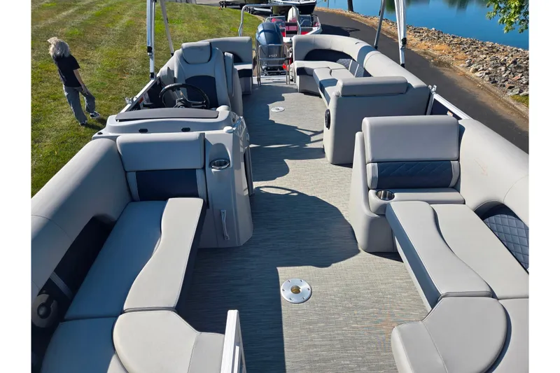Slide: The Image of 2022 Bennington L 22 L-Bench pontoon boat with spacious seating and modern design. - 11