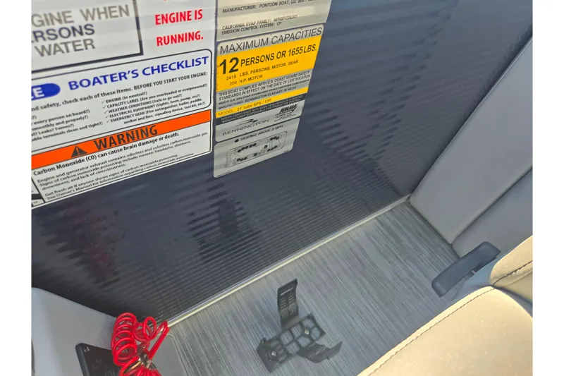 Slide: The Image of 2022 Bennington L 22 L-Bench boat capacity and safety warning labels. - 14