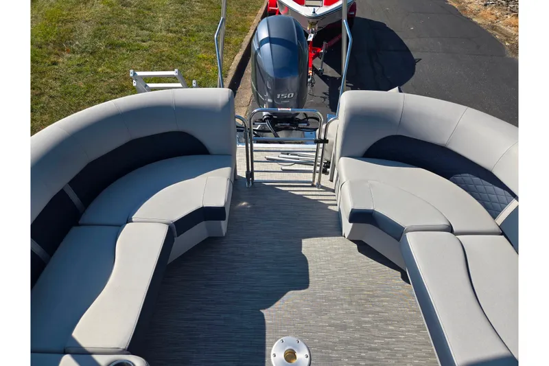 Slide: The Image of 2022 Bennington L 22 L-Bench pontoon boat with spacious seating and powerful outboard motor. - 16