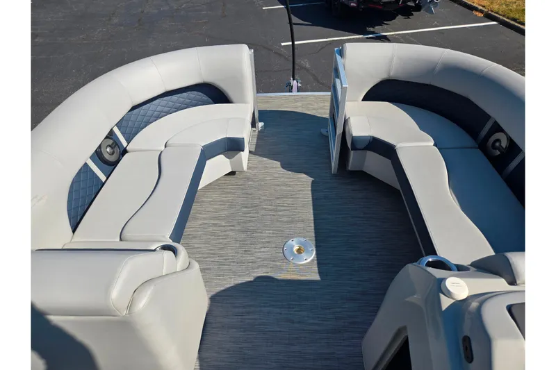 Slide: The Image of 2022 Bennington L 22 L-Bench pontoon boat interior with gray seating and flooring. - 21