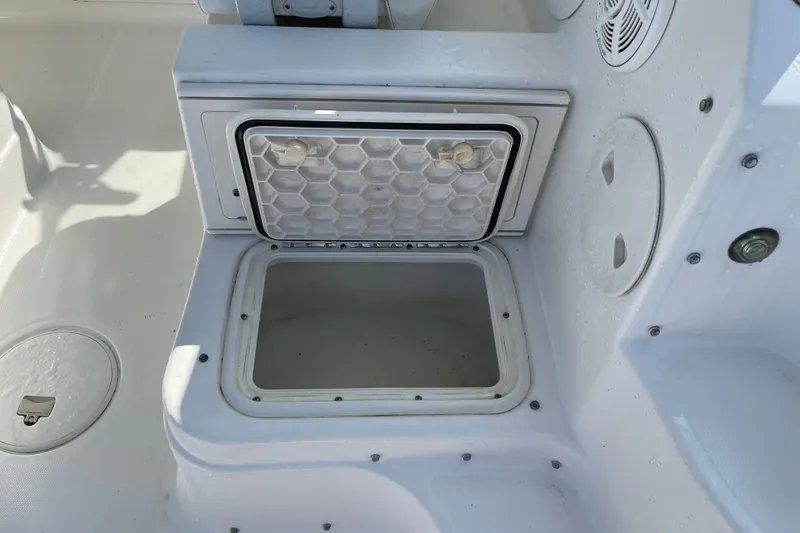 Slide: The Image of Open storage compartment on 2007 Wellcraft 252 Coastal boat deck. - 25