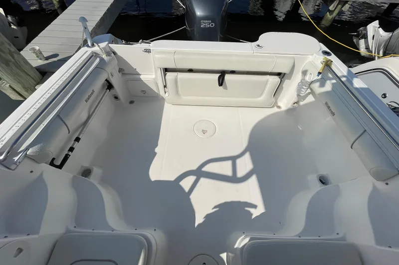 Slide: The Image of 2007 Wellcraft 252 Coastal boat interior with Yamaha 250 engine, docked at marina. - 28