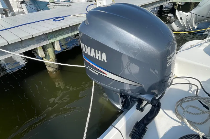 Slide: The Image of Yamaha outboard motor on 2007 Wellcraft 252 Coastal boat docked by wooden pier. - 38